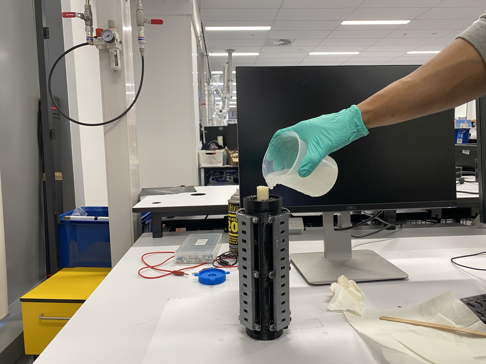 Pouring Ecoflex silicone into the 3D-printed mold
